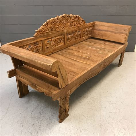 Carved teak bench .